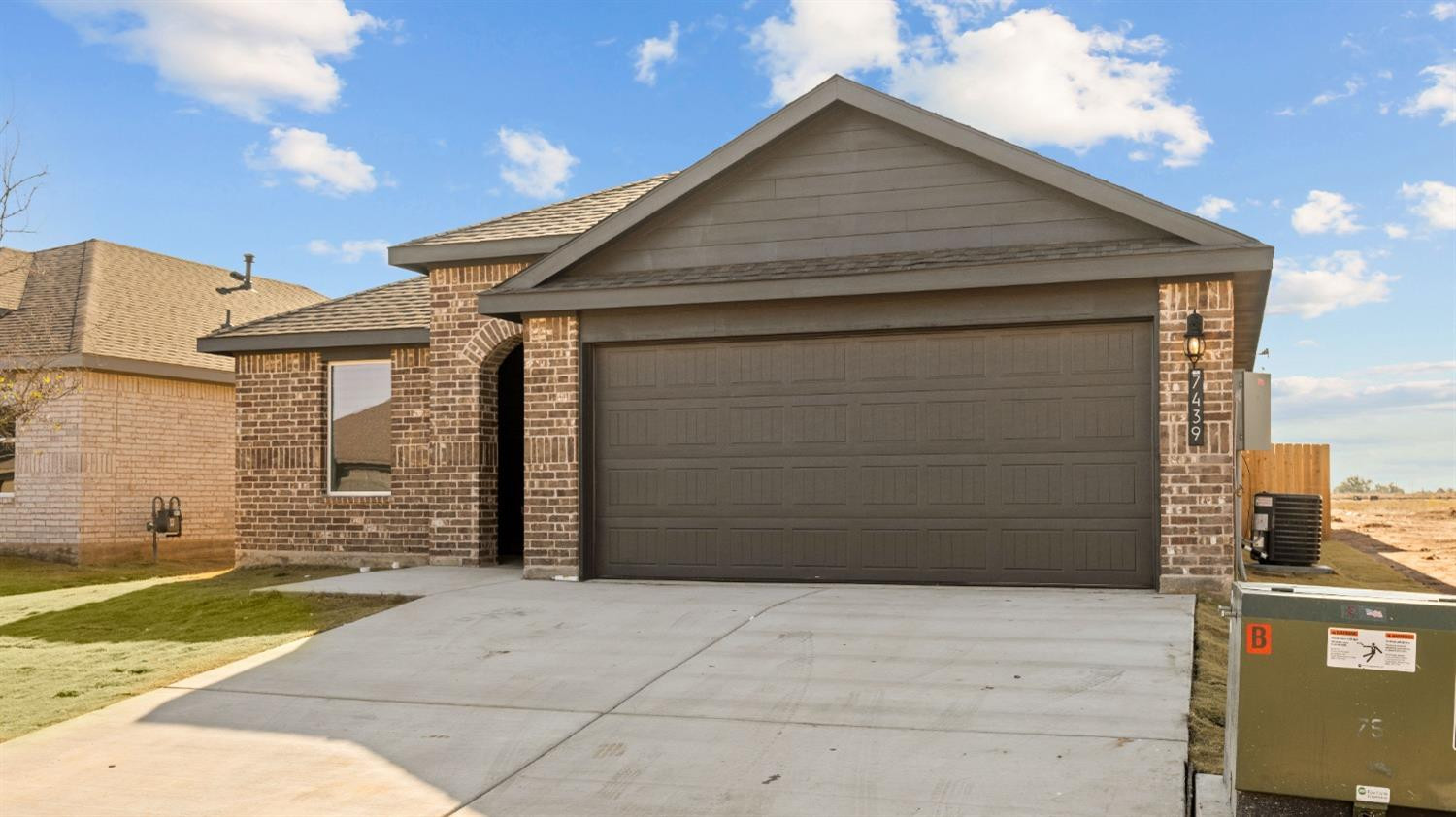 7448 8th Street Lubbock, TX 79416 - Photo 2 of 22 a front view of a house