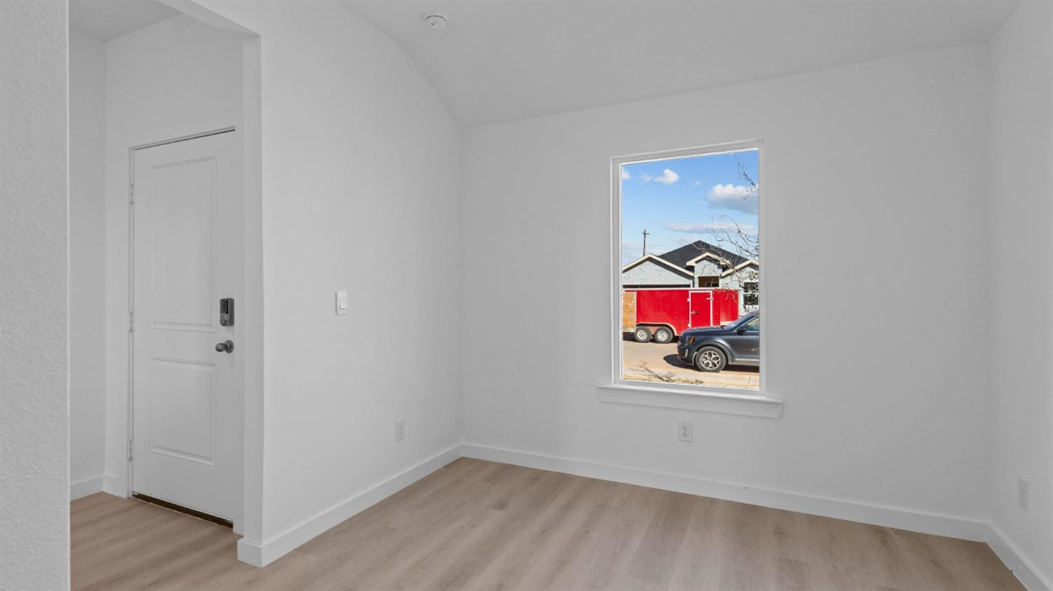 7448 8th Street Lubbock, TX 79416 - Photo 4 of 22 a view of an empty room with wooden floor and closet