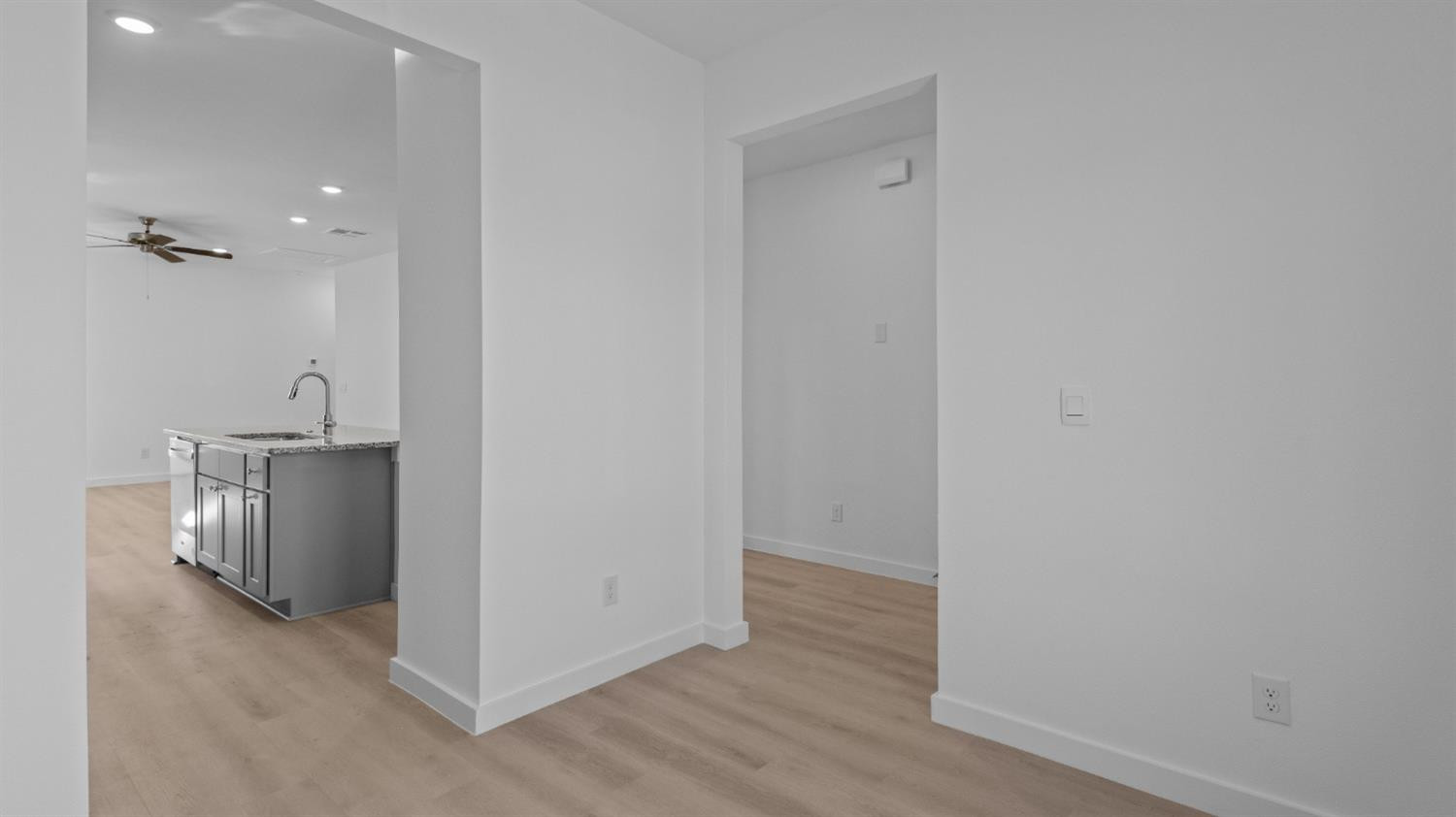 7448 8th Street Lubbock, TX 79416 - Photo 5 of 22 a view of a room with wooden floor
