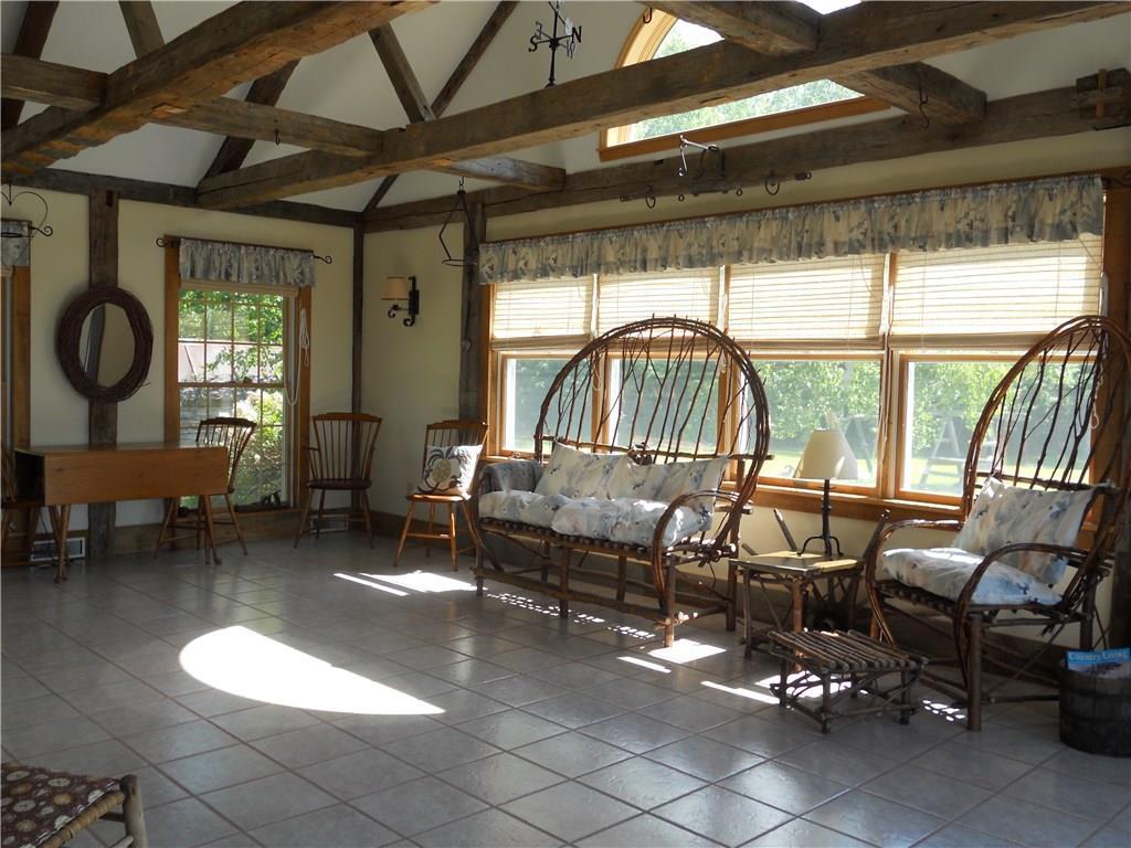 173 Ward Hill Road Madison, ME 04950 - Photo 11 of 35 Four-season sunroom with vaulted...