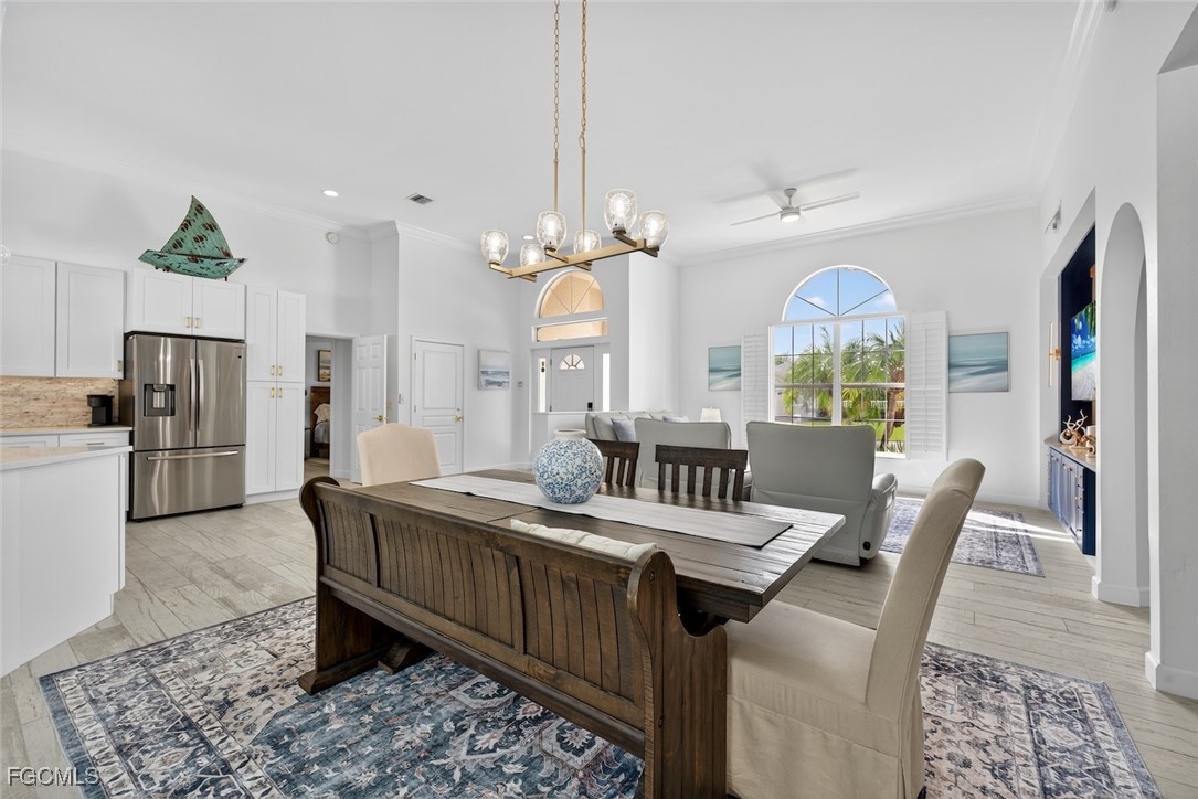 13570 Harbour Ridge Drive Fort Myers, FL 33908 - Photo 12 of 50 a large kitchen with a table and chairs