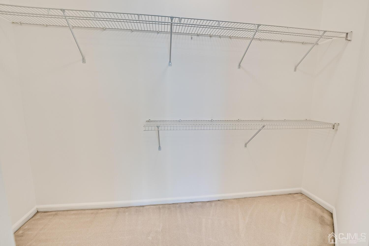 22 Prestwick Way Edison, NJ 08820 - Photo 17 of 24 a view of a room with racks on the wall