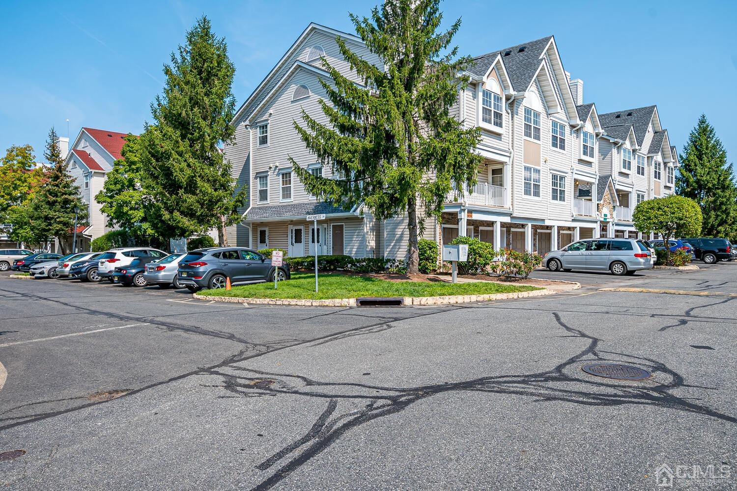 22 Prestwick Way Edison, NJ 08820 - Photo 2 of 24 a view of street with parked cars