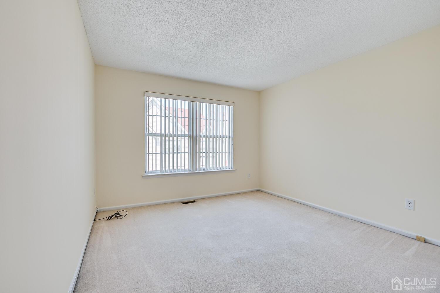 22 Prestwick Way Edison, NJ 08820 - Photo 21 of 24 an empty room with a window