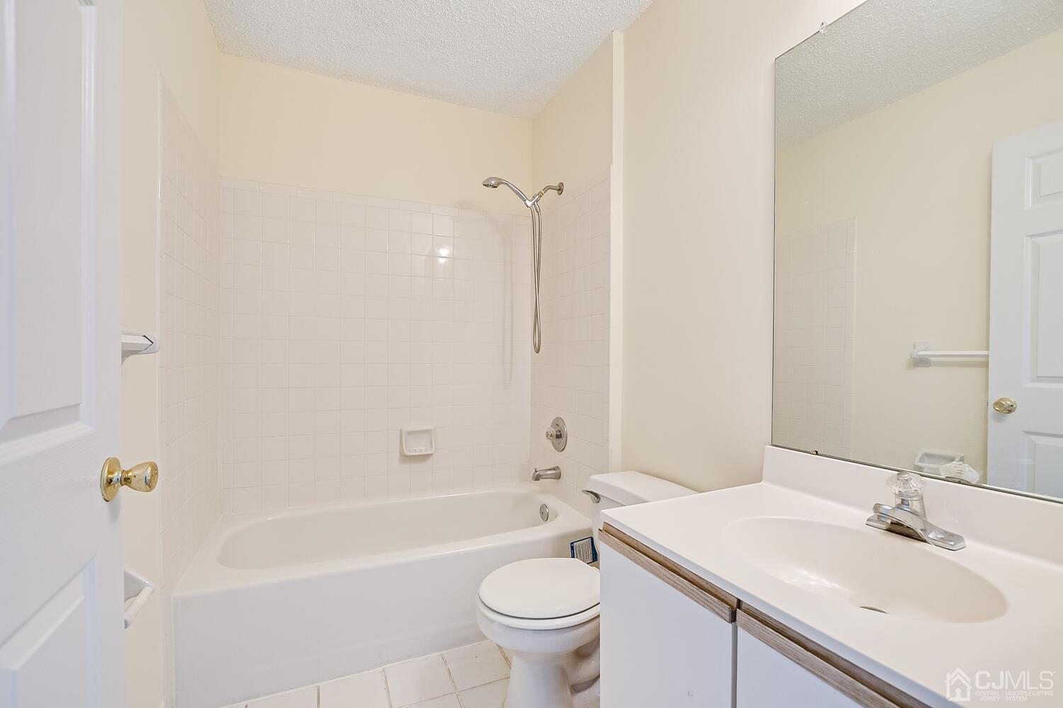 22 Prestwick Way Edison, NJ 08820 - Photo 23 of 24 a bathroom with a sink a toilet and shower