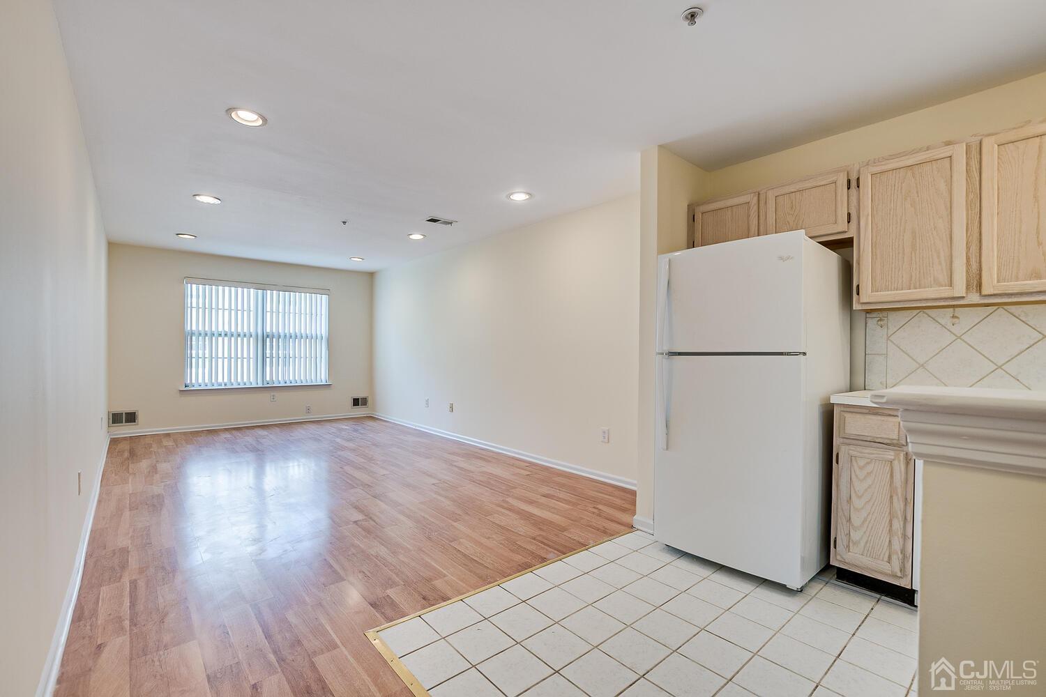 22 Prestwick Way Edison, NJ 08820 - Photo 6 of 24 a view of empty room with wooden floor