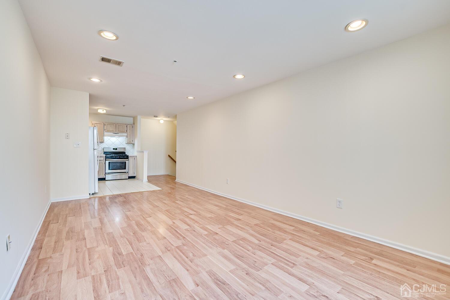 22 Prestwick Way Edison, NJ 08820 - Photo 8 of 24 a view of a big room with wooden floor and a window