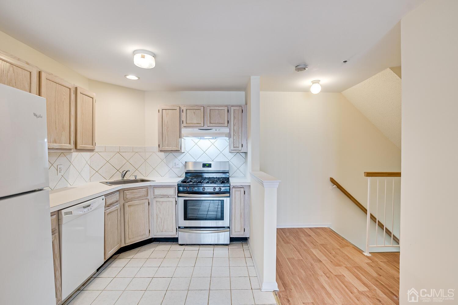 22 Prestwick Way Edison, NJ 08820 - Photo 9 of 24 a kitchen with stainless steel appliances a sink stove and refrigerator