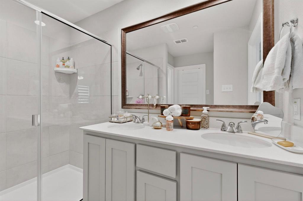 6040 Bursey Road Watauga, TX 76148 - Photo 27 of 39 a bathroom with a sink and a mirror