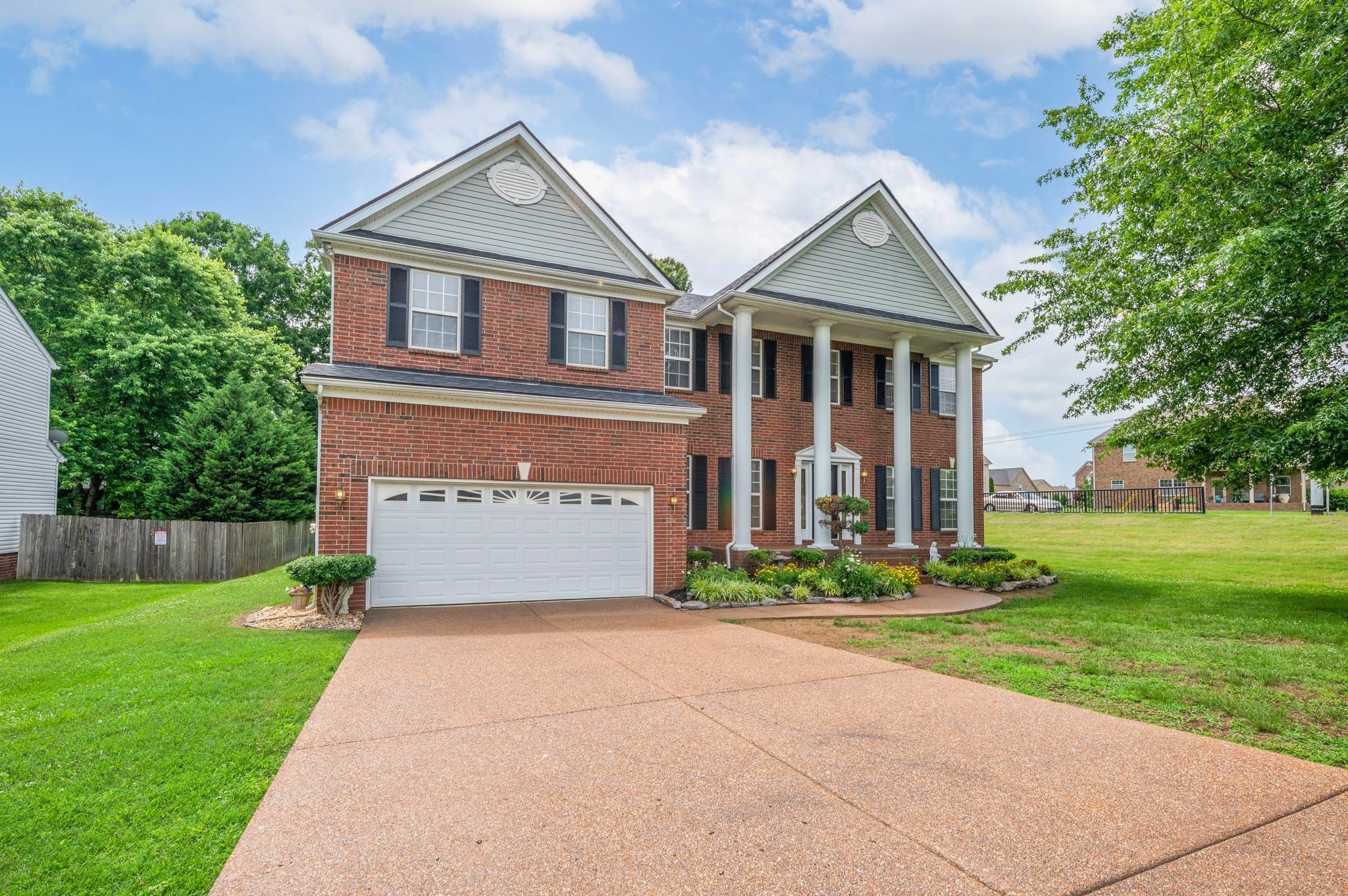 2901 Buckner Lane Spring Hill, TN 37174 - Photo 2 of 28 a front view of a house with garden