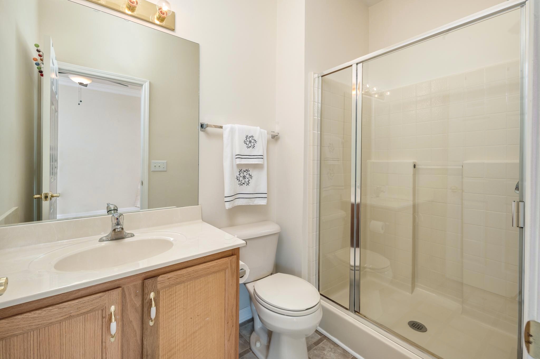 2901 Buckner Lane Spring Hill, TN 37174 - Photo 13 of 28 a bathroom with a sink toilet and shower