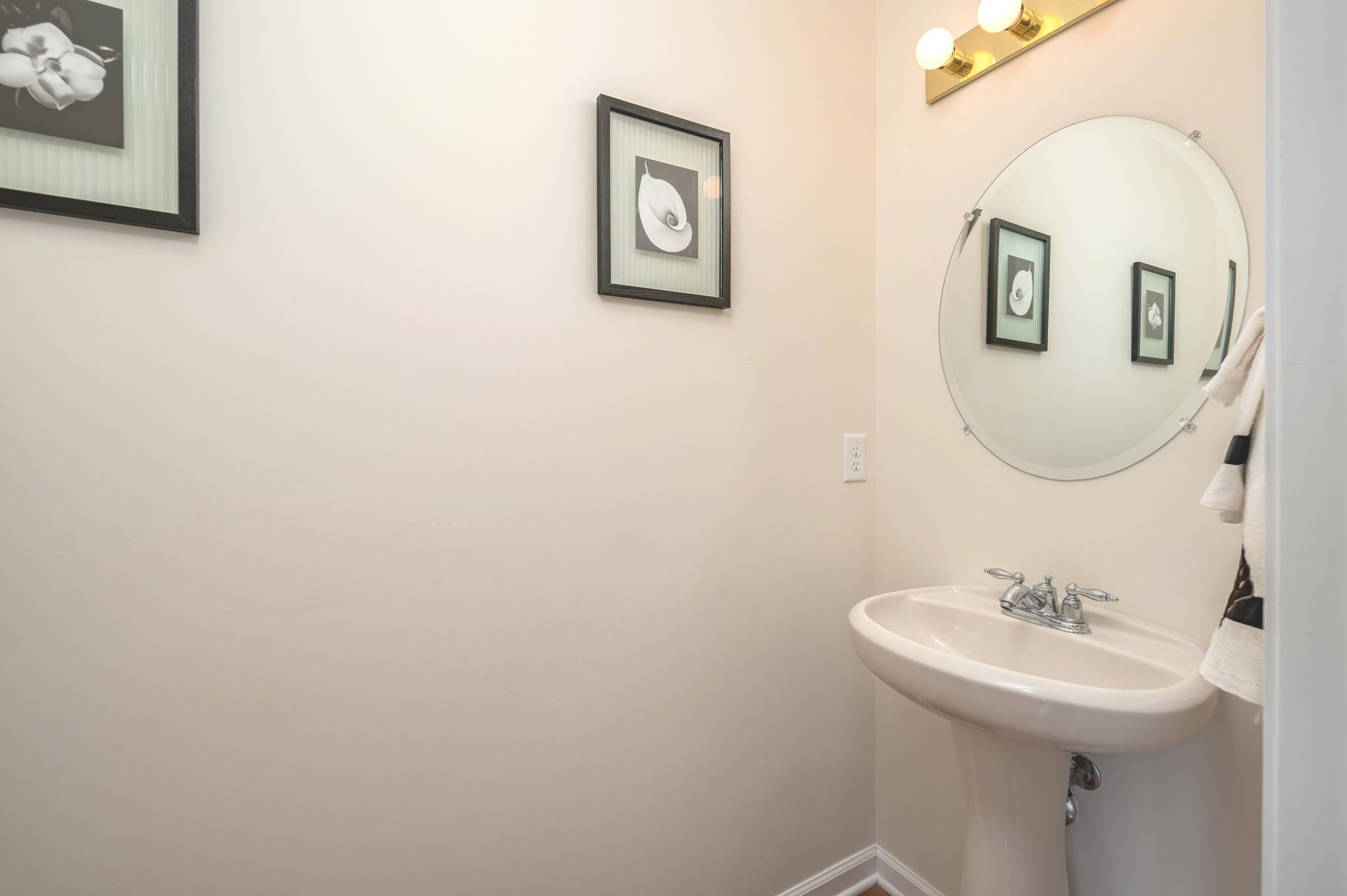 2901 Buckner Lane Spring Hill, TN 37174 - Photo 14 of 28 a bathroom with a sink and a mirror
