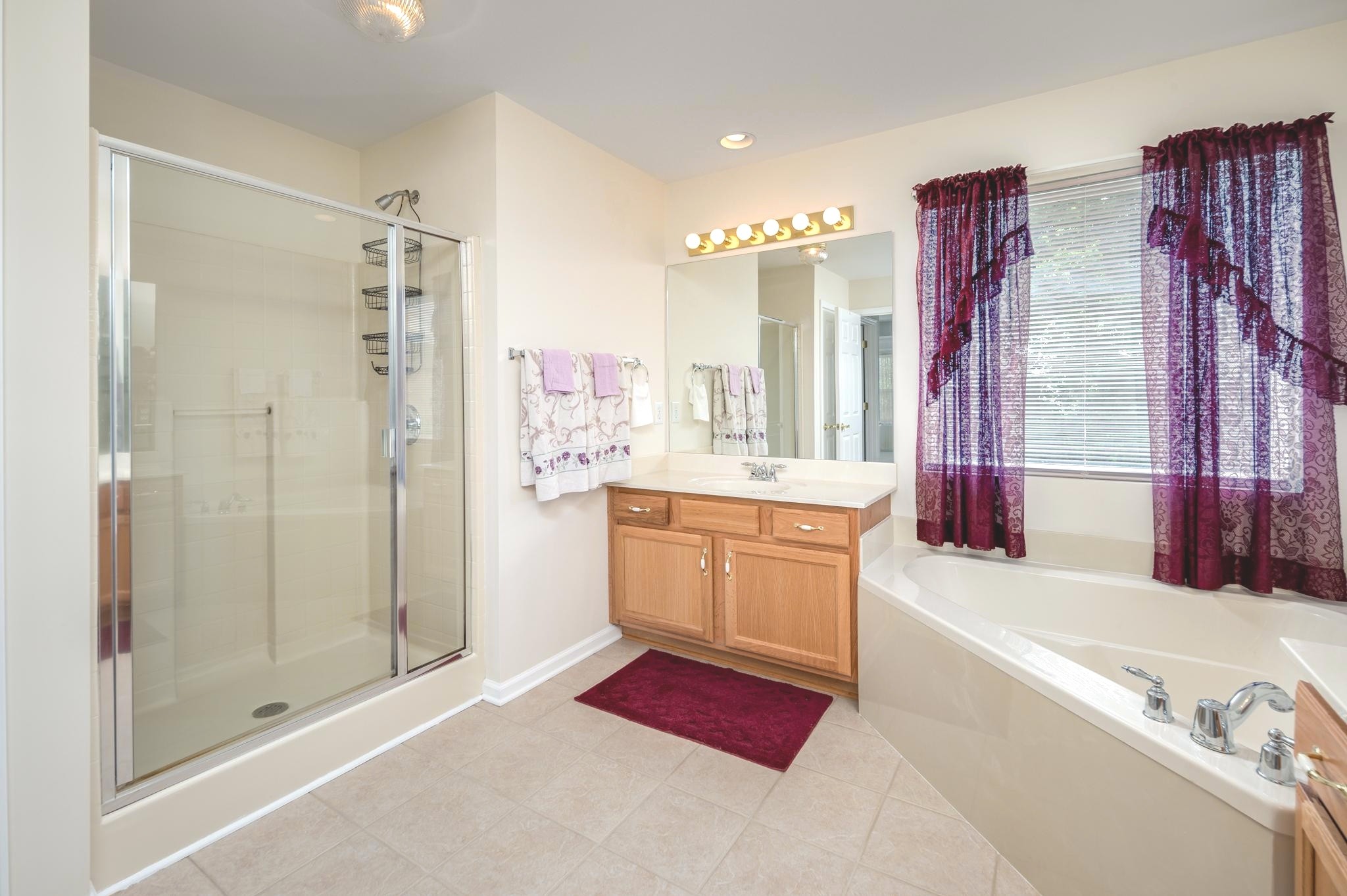 2901 Buckner Lane Spring Hill, TN 37174 - Photo 21 of 28 a bathroom with a tub sink and shower