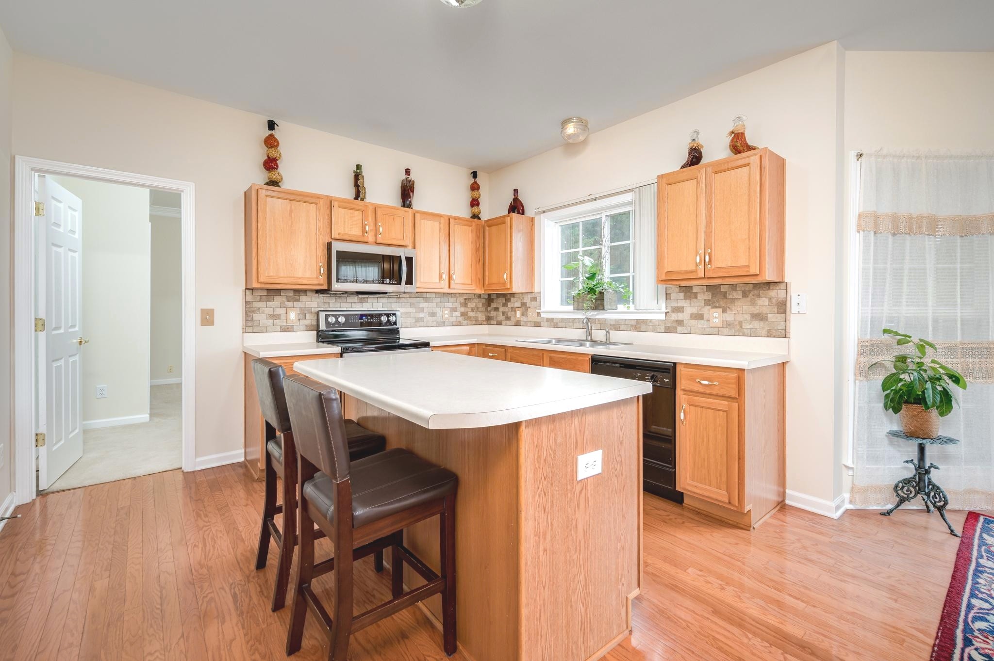 2901 Buckner Lane Spring Hill, TN 37174 - Photo 6 of 28 a kitchen with a stove a sink and a refrigerator