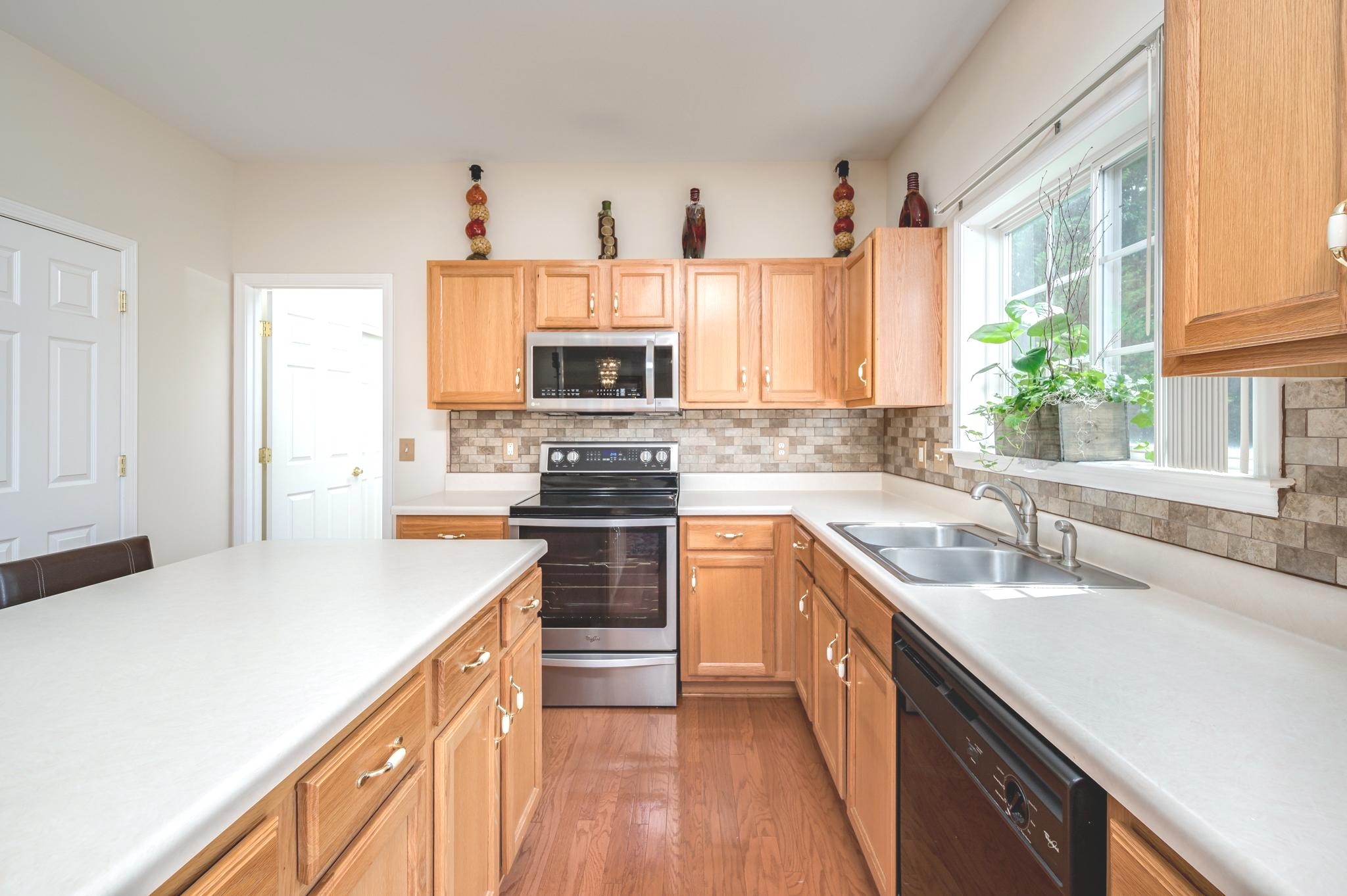 2901 Buckner Lane Spring Hill, TN 37174 - Photo 7 of 28 a kitchen with kitchen island granite countertop a sink appliances cabinets and counter space