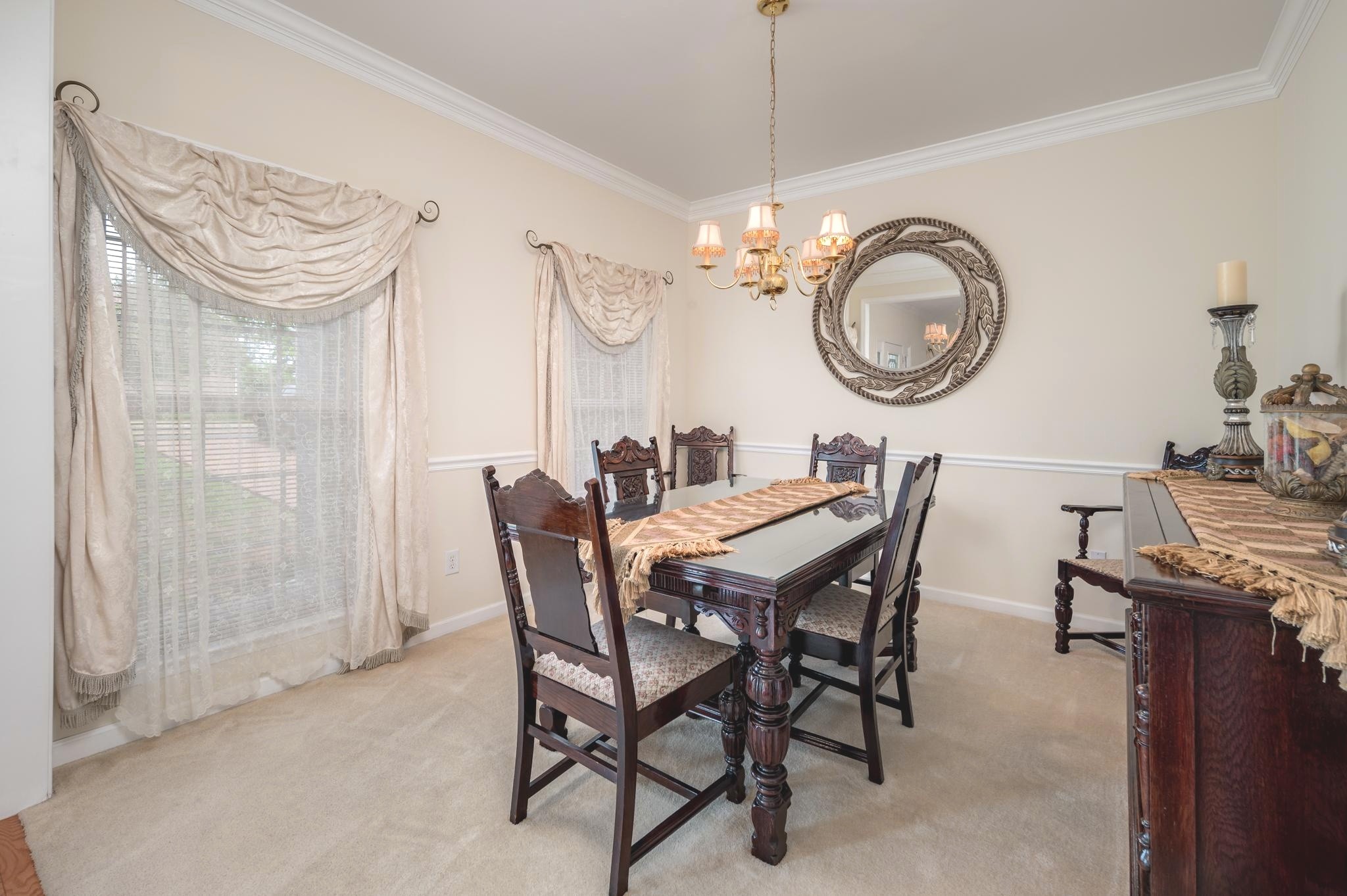 2901 Buckner Lane Spring Hill, TN 37174 - Photo 10 of 28 a dining room with wooden floor a chandelier a wooden table and chairs