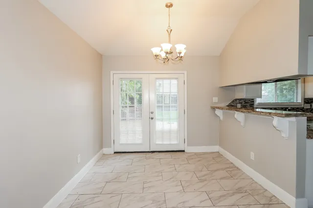 a view of a kitchen with a sink and dishwasher