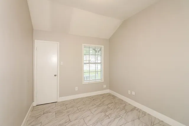 an empty room with windows