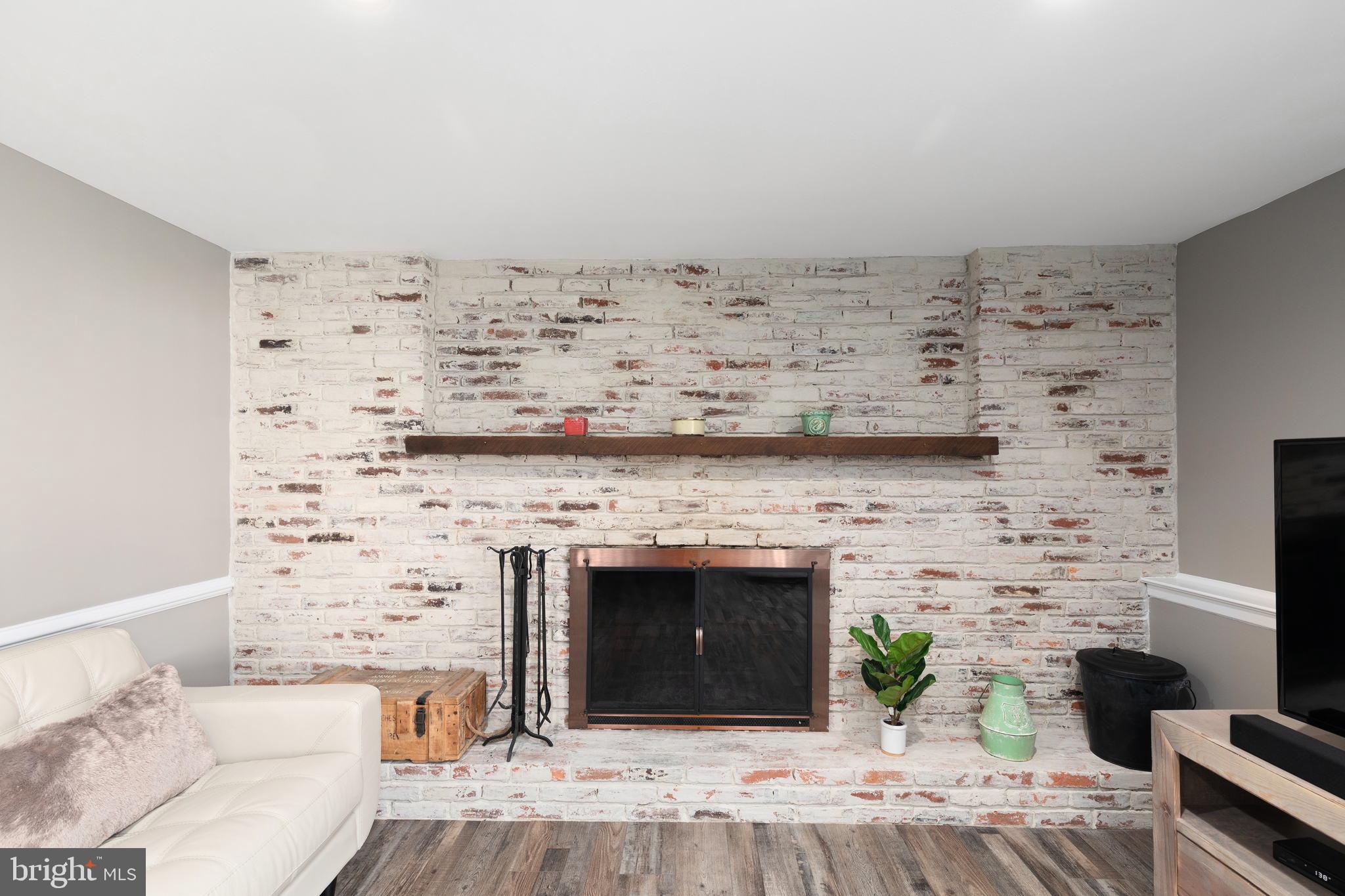 108 Ardoon Road Lutherville-Timonium, MD 21093 - Photo 23 of 36 Beautiful Brick accent wall with Fire Place