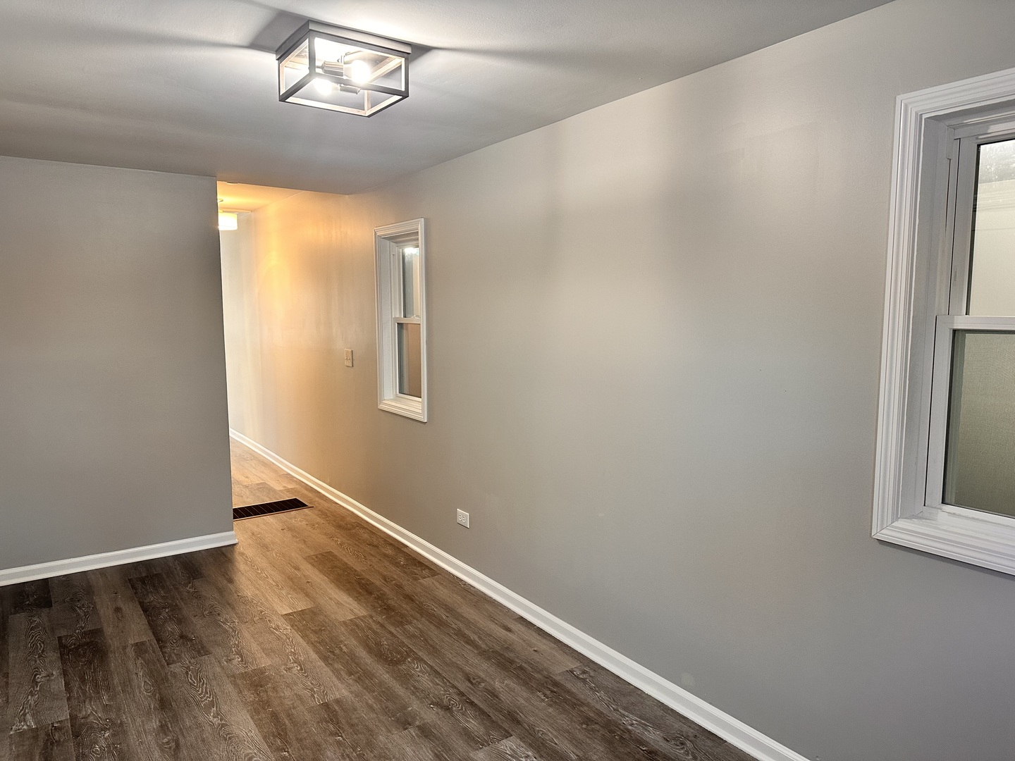 518 Spring Street Streator, IL 61364 - Photo 7 of 17 an empty room with wooden floor chandelier and windows