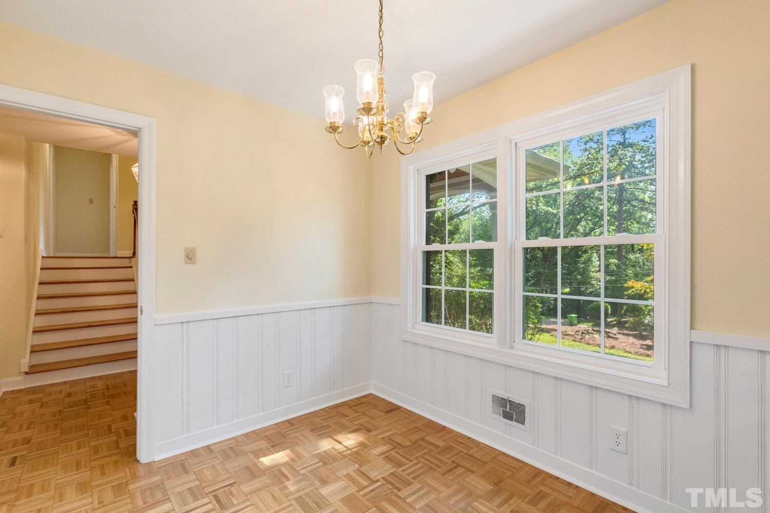 5004 Rembert Drive Raleigh, NC 27612 - Photo 12 of 61 a view of an empty room with a window