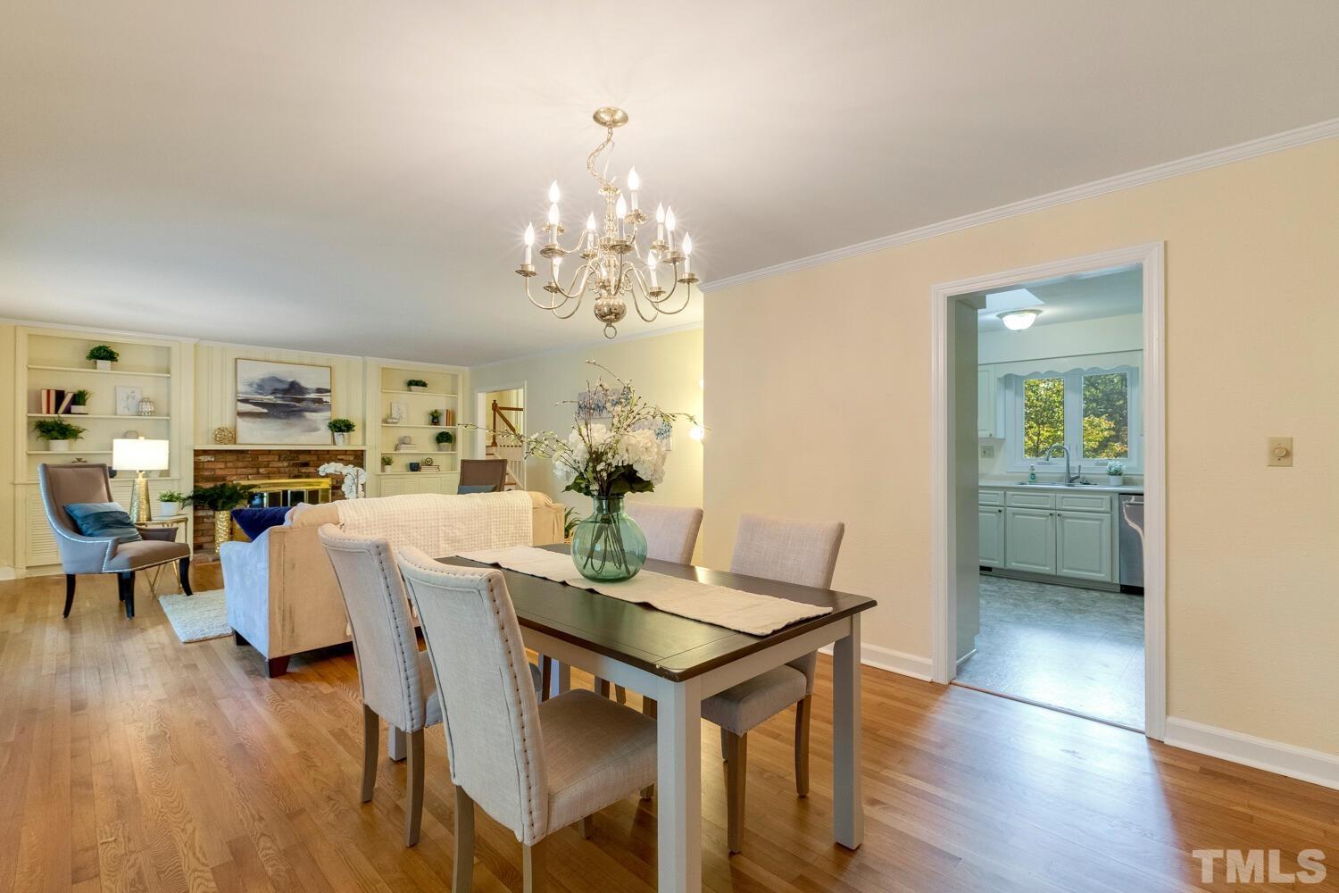 5004 Rembert Drive Raleigh, NC 27612 - Photo 13 of 61 a view of a dining room with furniture and wooden floor