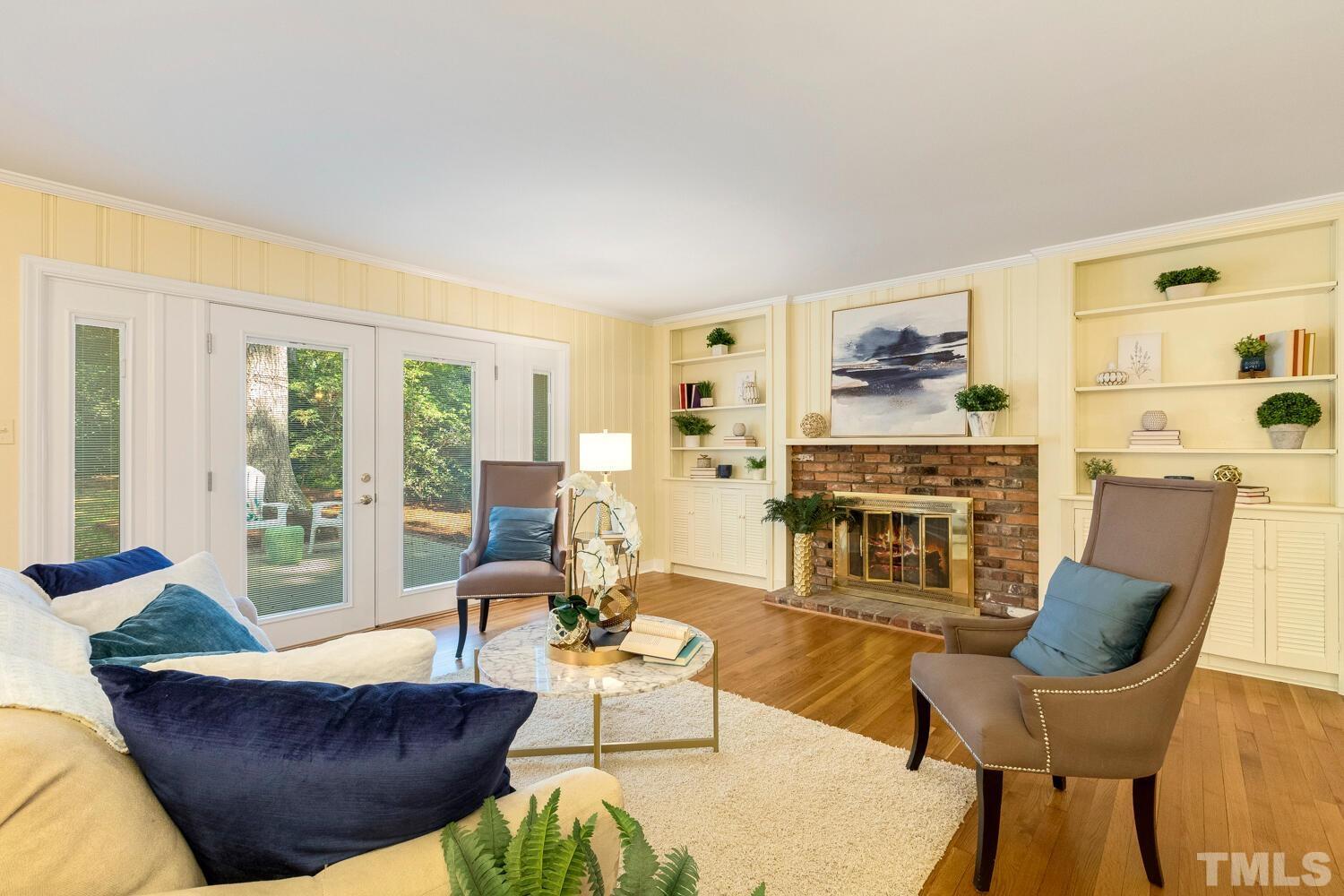 5004 Rembert Drive Raleigh, NC 27612 - Photo 17 of 61 a living room with fireplace furniture and a large window