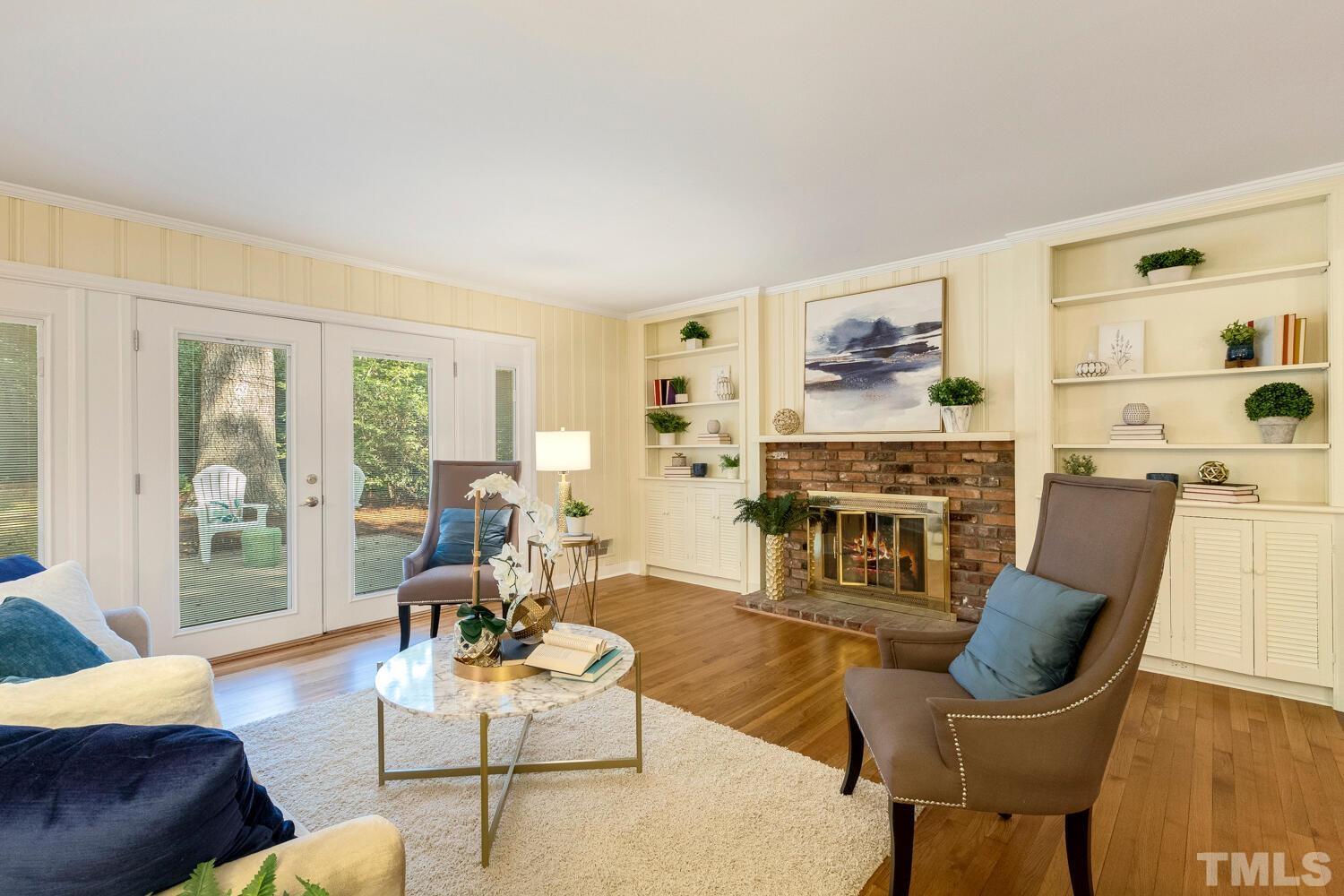 5004 Rembert Drive Raleigh, NC 27612 - Photo 18 of 61 a living room with furniture and a large window