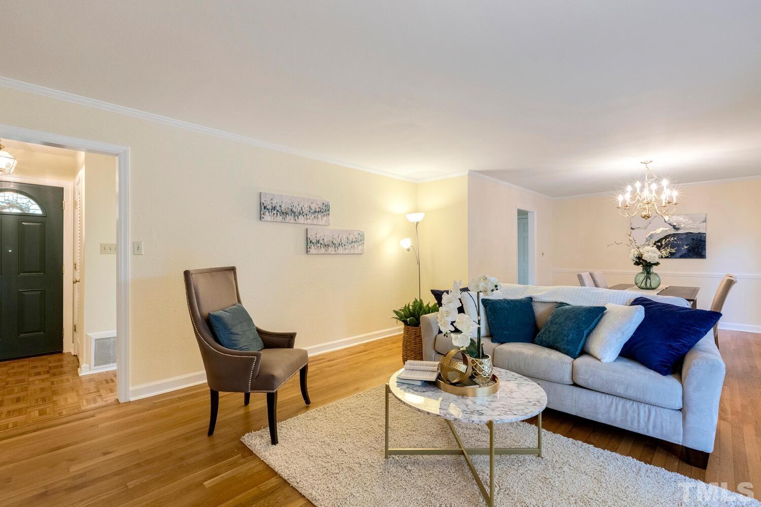5004 Rembert Drive Raleigh, NC 27612 - Photo 20 of 61 a living room with furniture and wooden floor