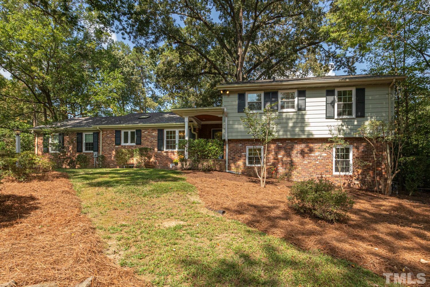 5004 Rembert Drive Raleigh, NC 27612 - Photo 2 of 61 front view of a house with a yard