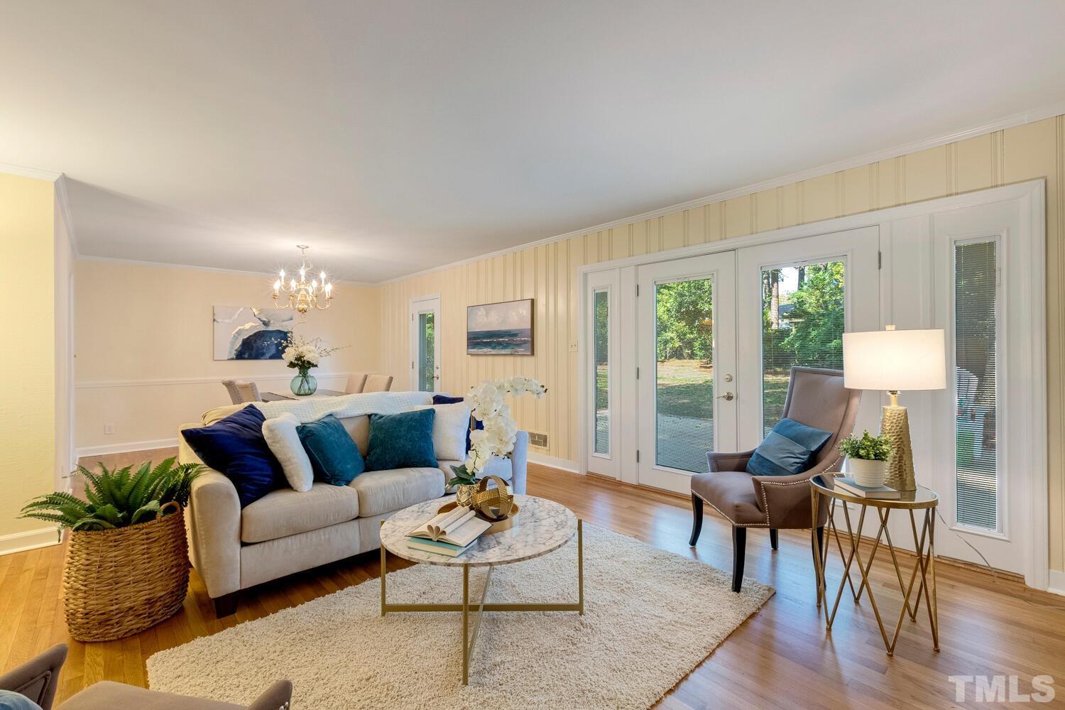 5004 Rembert Drive Raleigh, NC 27612 - Photo 21 of 61 a living room with furniture and a large window