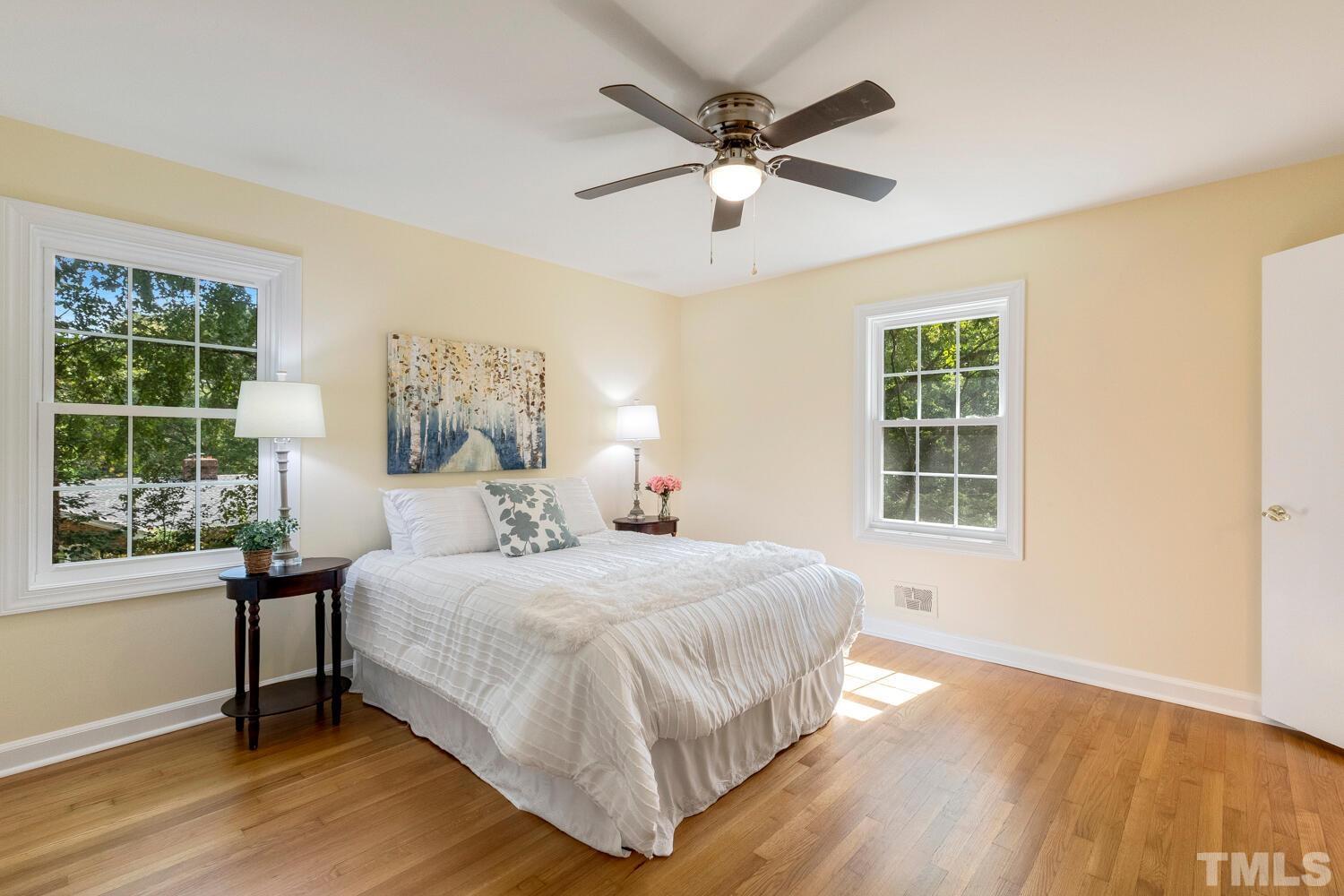 5004 Rembert Drive Raleigh, NC 27612 - Photo 22 of 61 a bedroom with a large bed and a window