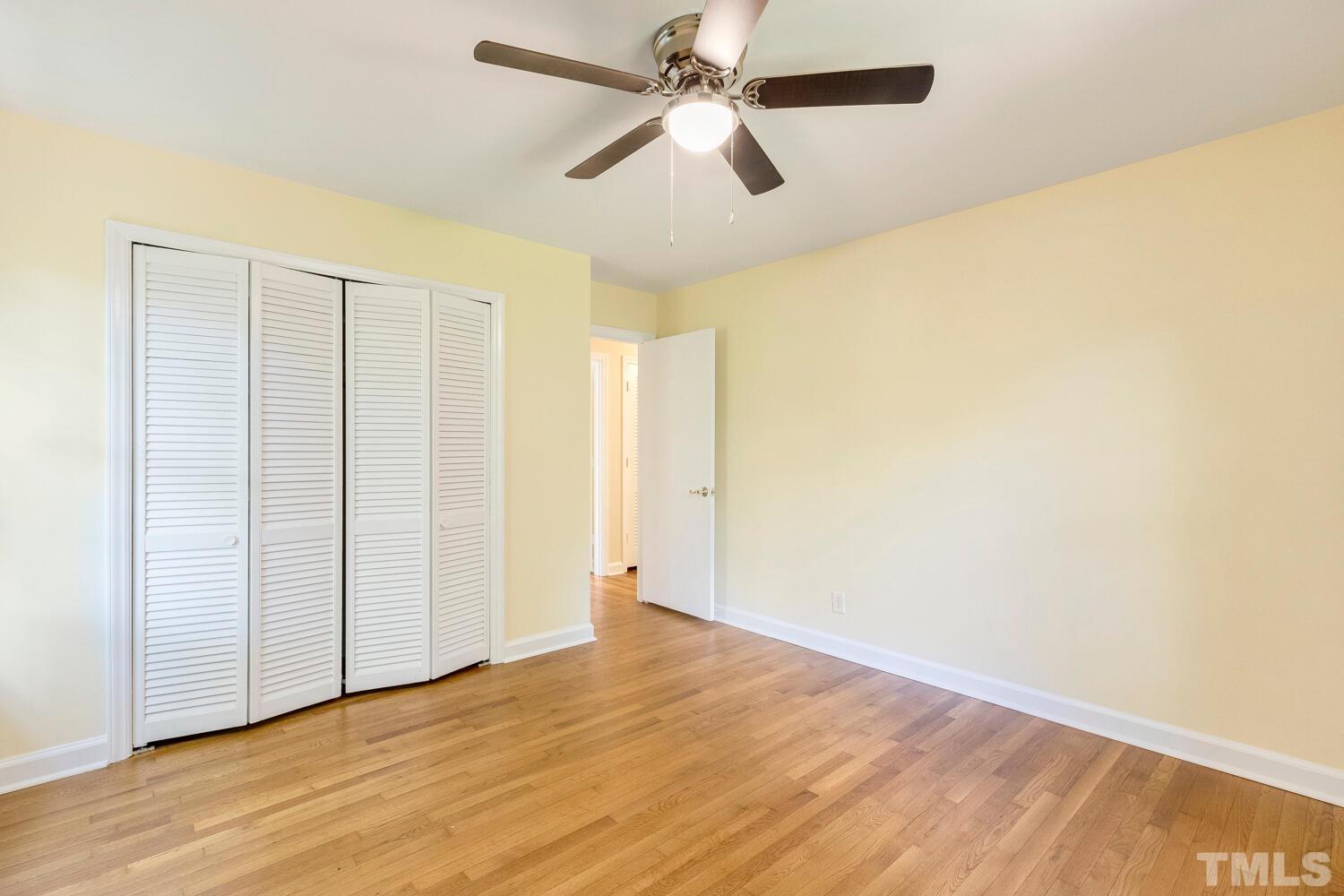 5004 Rembert Drive Raleigh, NC 27612 - Photo 27 of 61 a view of empty room with wooden floor