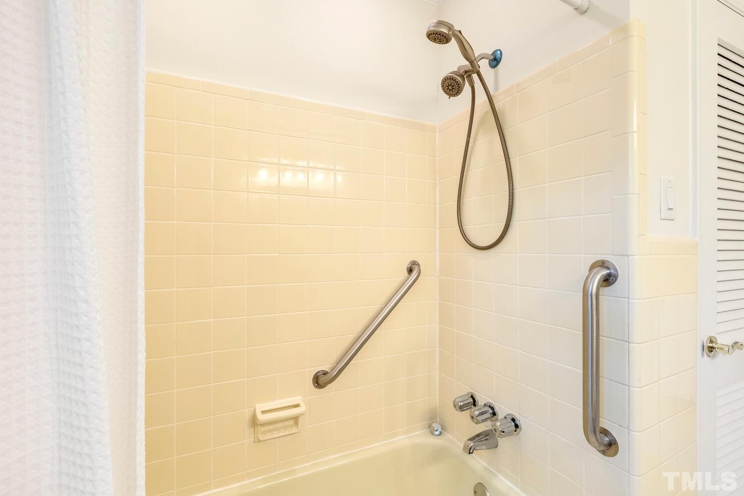 5004 Rembert Drive Raleigh, NC 27612 - Photo 32 of 61 a bathroom with a bath tub