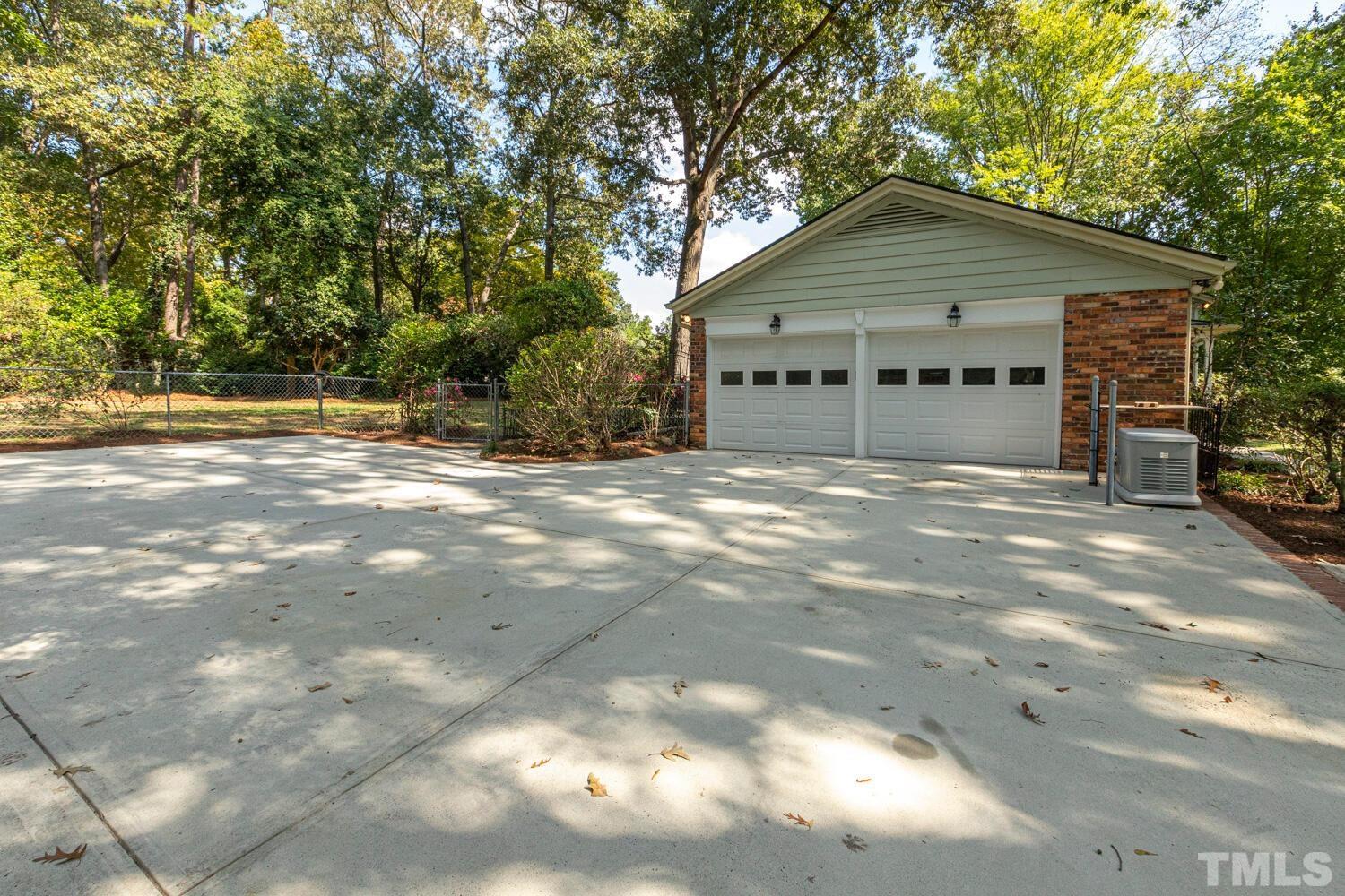 5004 Rembert Drive Raleigh, NC 27612 - Photo 47 of 61 a view of a house with a yard