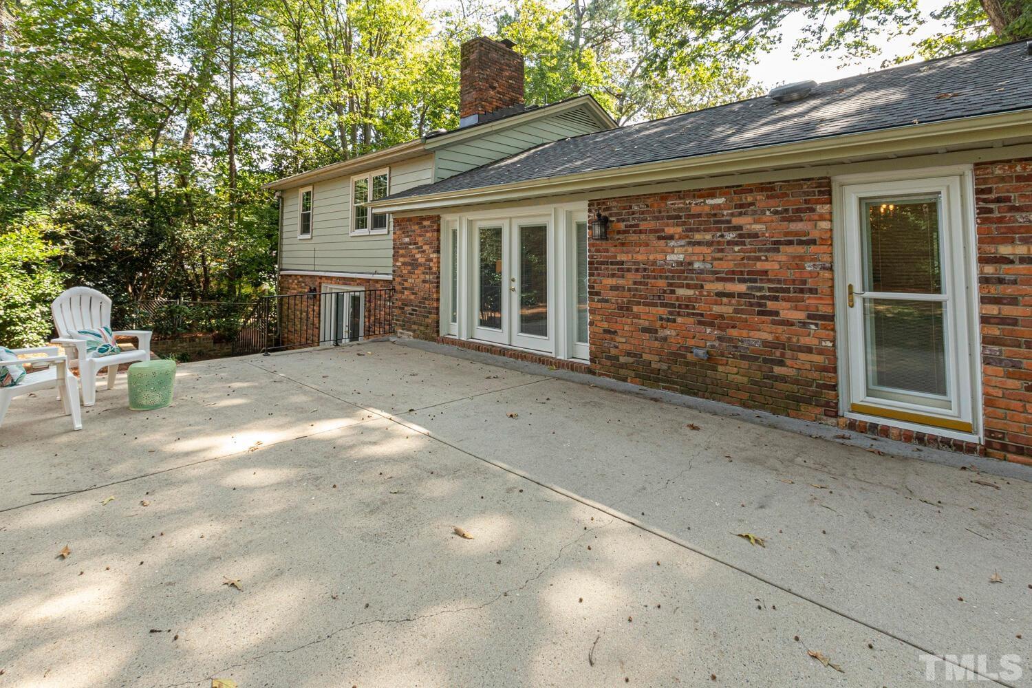 5004 Rembert Drive Raleigh, NC 27612 - Photo 48 of 61 a view of backyard with a chair and tables
