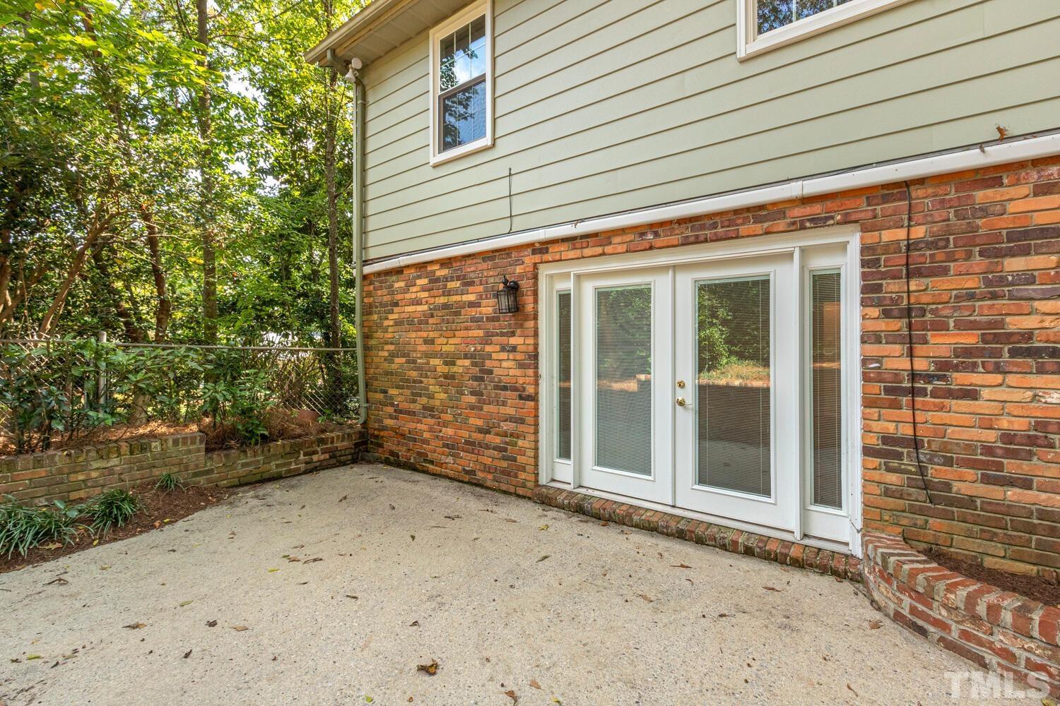 5004 Rembert Drive Raleigh, NC 27612 - Photo 57 of 61 front view of a house with a outdoor space