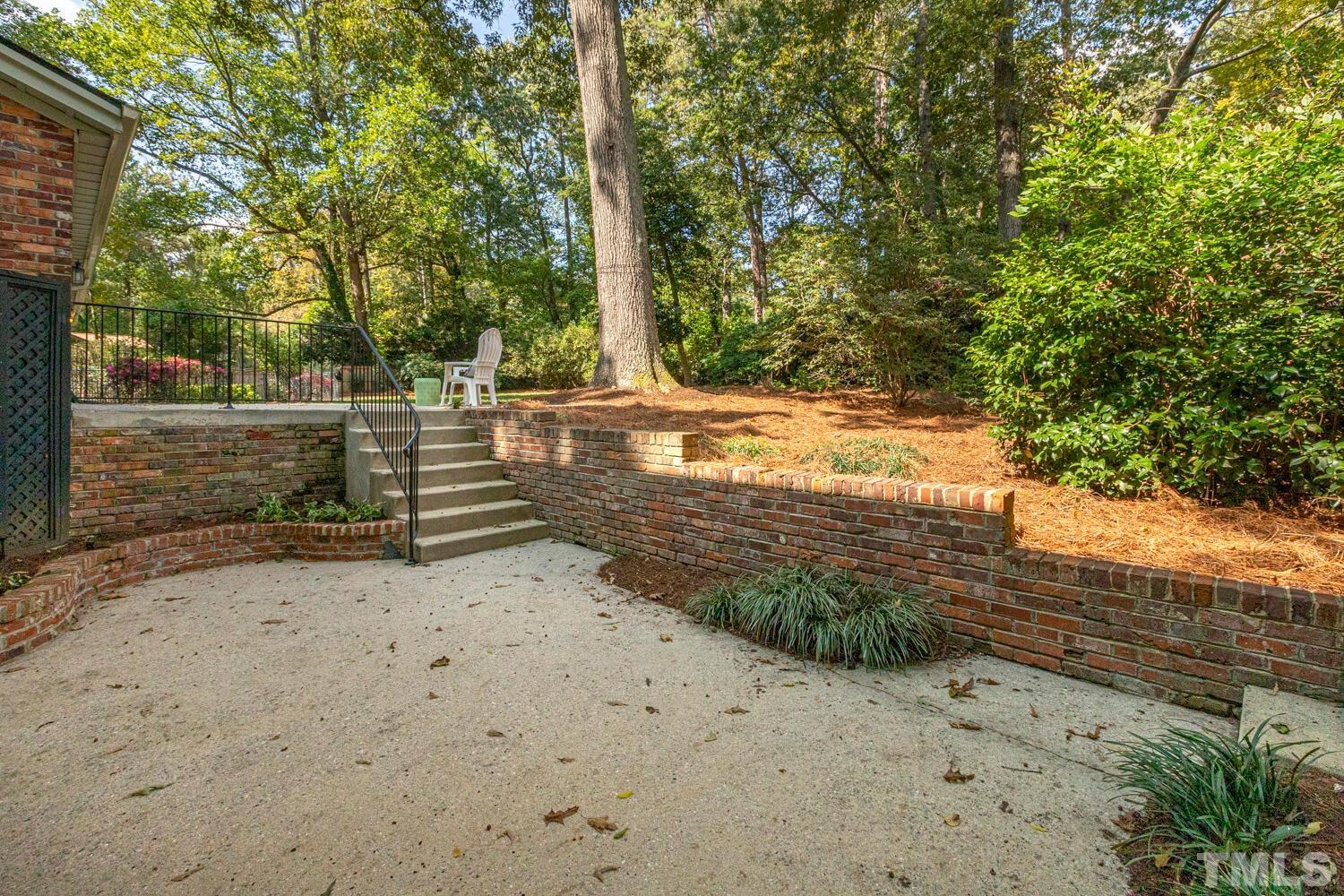 5004 Rembert Drive Raleigh, NC 27612 - Photo 58 of 61 a view of a yard with trees
