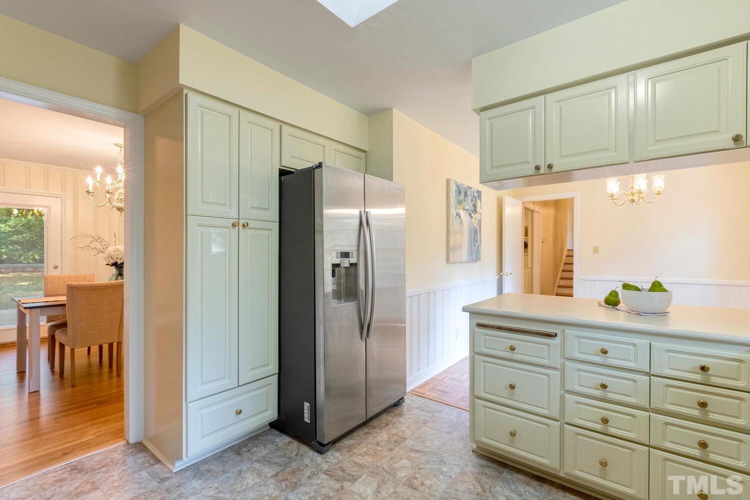 5004 Rembert Drive Raleigh, NC 27612 - Photo 7 of 61 a bathroom with a shower sink and mirror