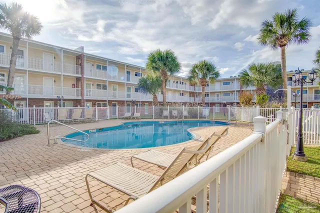 a view of a swimming pool with a patio