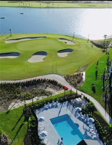 a front view of a house with a yard and potted plants