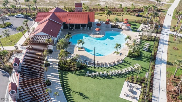 a view of swimming pool with a yard and outdoor seating