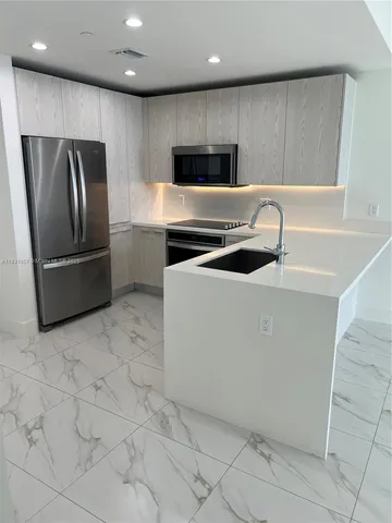 an empty room with windows and yard