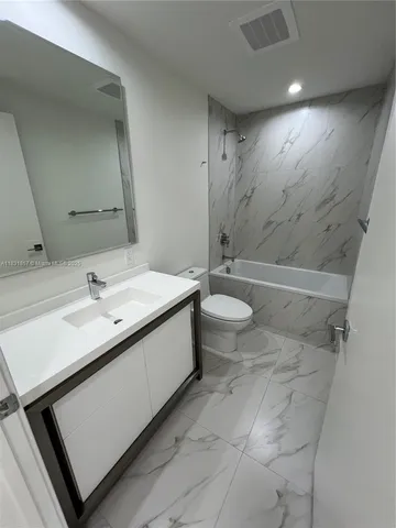 an empty room with wooden floor