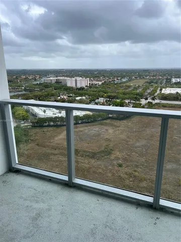 an aerial view of residential building and ocean
