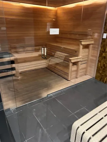 a living room with a couch and a table with wooden floor