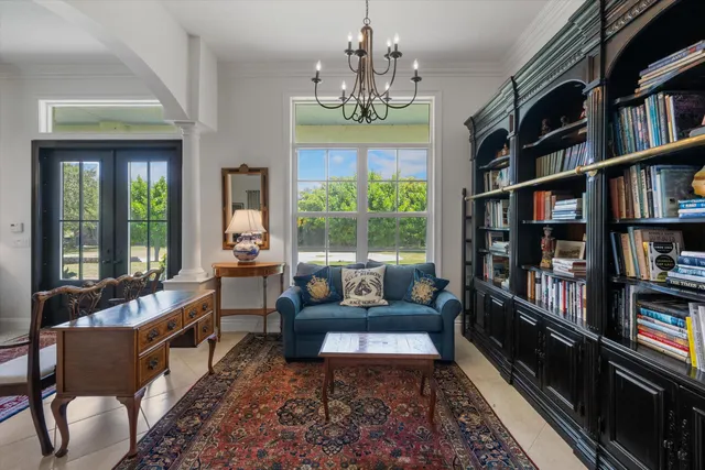 a kitchen with stainless steel appliances granite countertop a stove a sink a refrigerator and a microwave