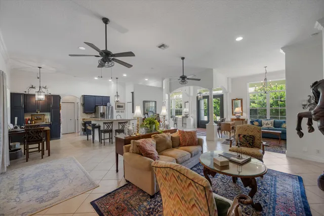 a living room with furniture rug and window