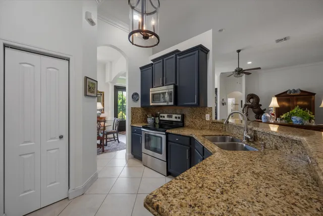 a spacious bedroom with a bed and a mirror