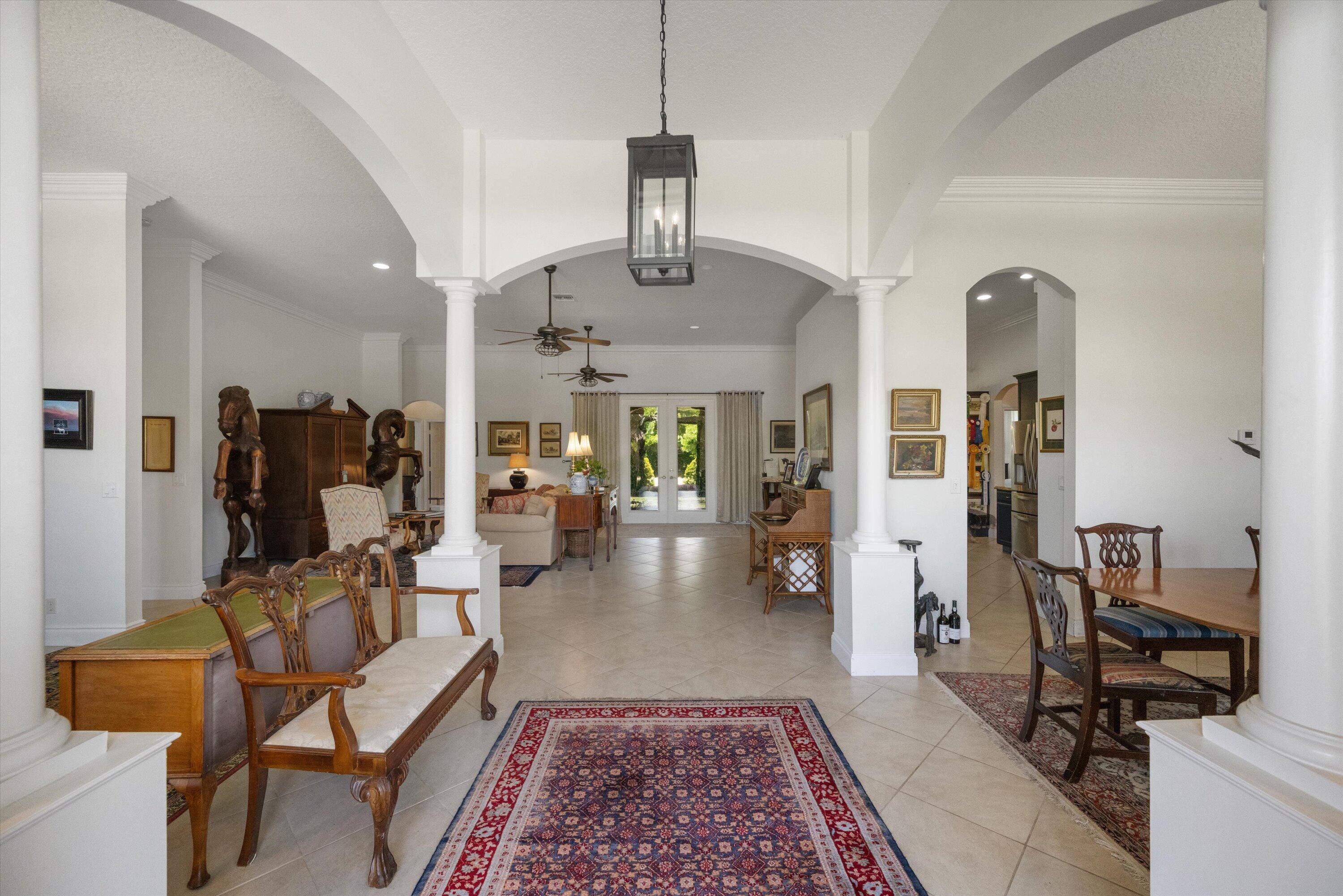 19986 Black Falcon Road Loxahatchee, FL 33470 - Photo 28 of 105 a living room with furniture rug and window